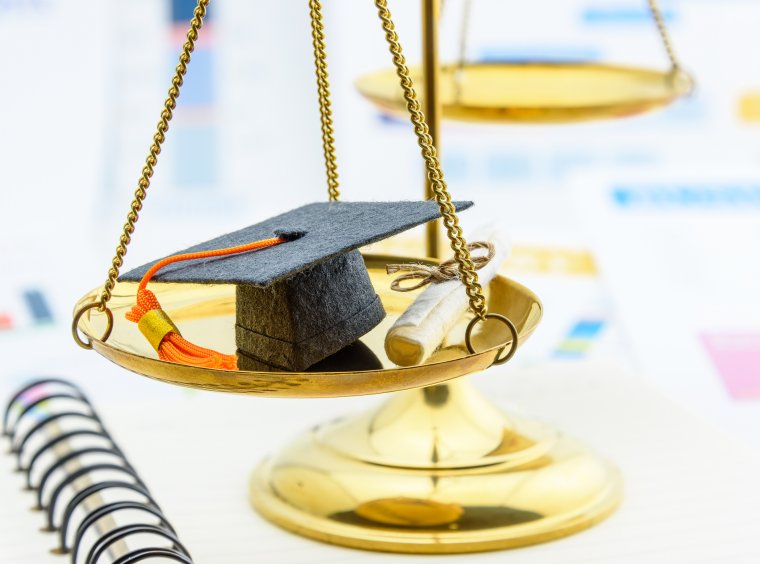 Graduation cap on balance of justice