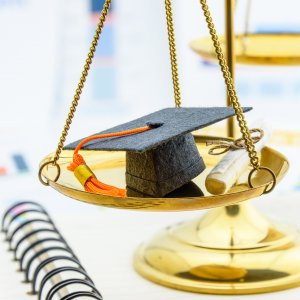 Graduation cap on balance of justice